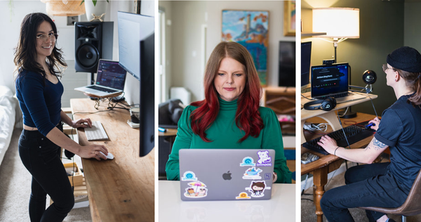 three women sitting in front of computers.